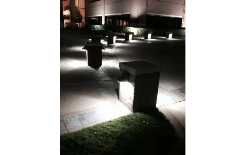 A photo of some benches in the dark.